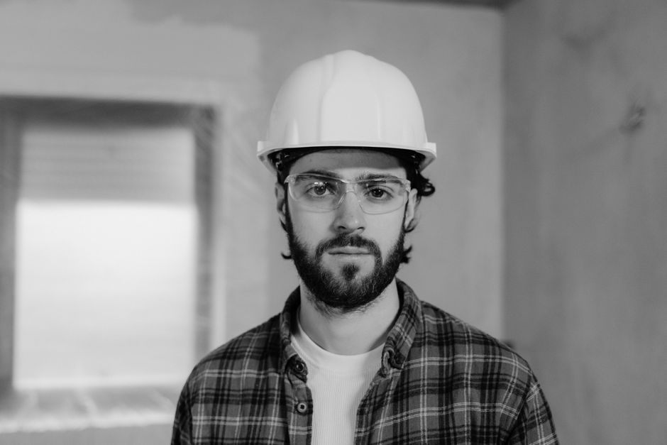 Smiling home improvement contractor reviewing plans